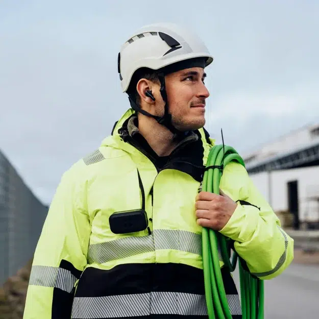 Voxear Protect Industrial Electronic Ear Plugs being worn during work